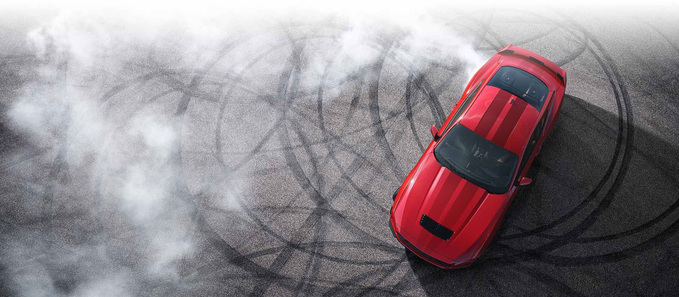 Overhead view of a 2024 Ford Mustang® model with tire tracks on pavement | Soeby Motor Company in Walhalla ND