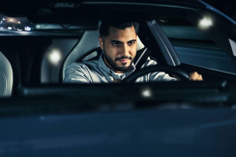 Person sitting in the driver’s seat of a parked 2024 Ford Mustang® coupe | Soeby Motor Company in Walhalla ND