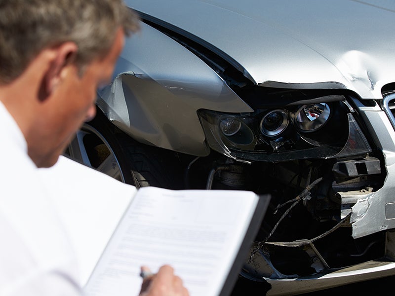advisor inspecting vehicle